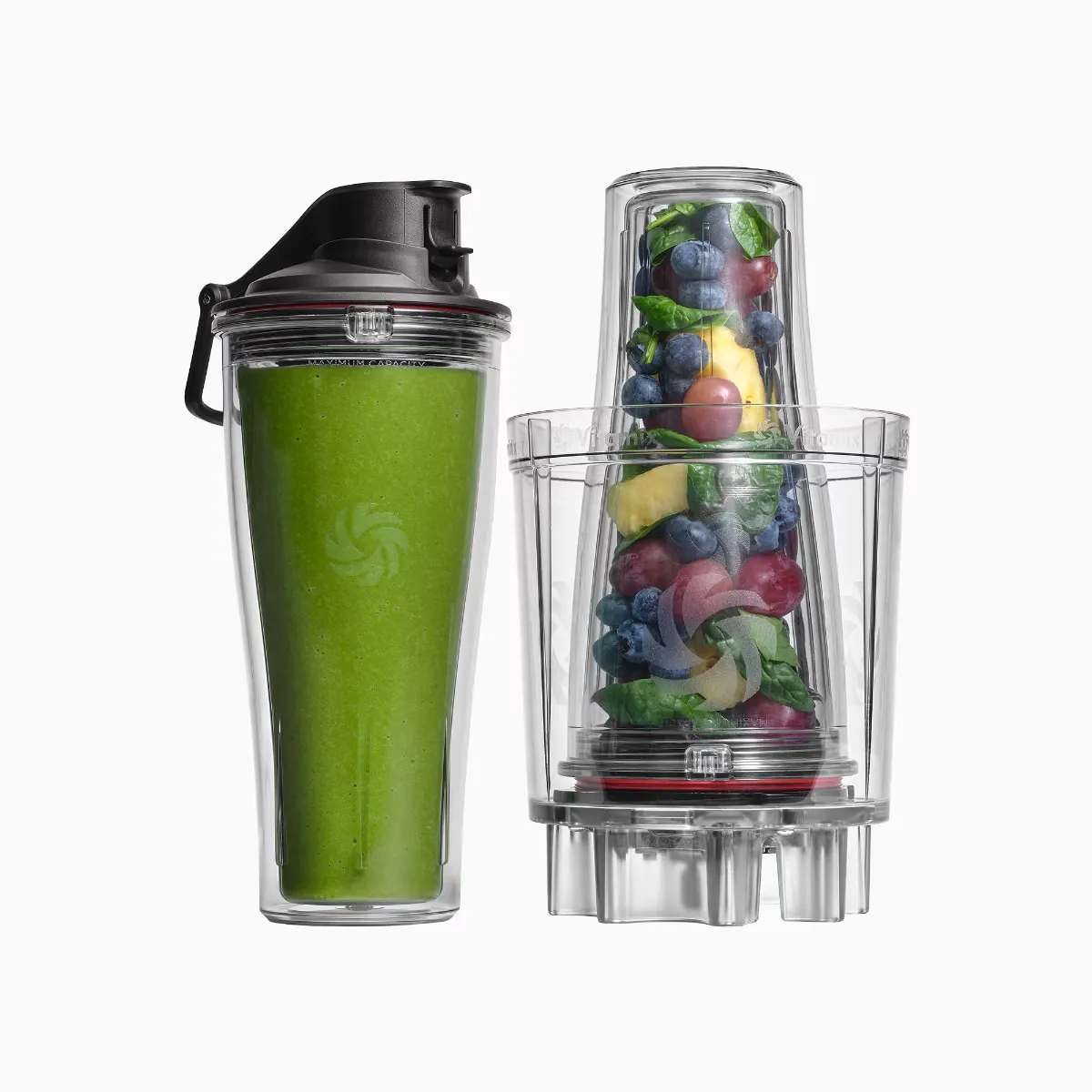 Attaching a Vitamix personal blending cup to its specific blade base for a single-serve smoothie.