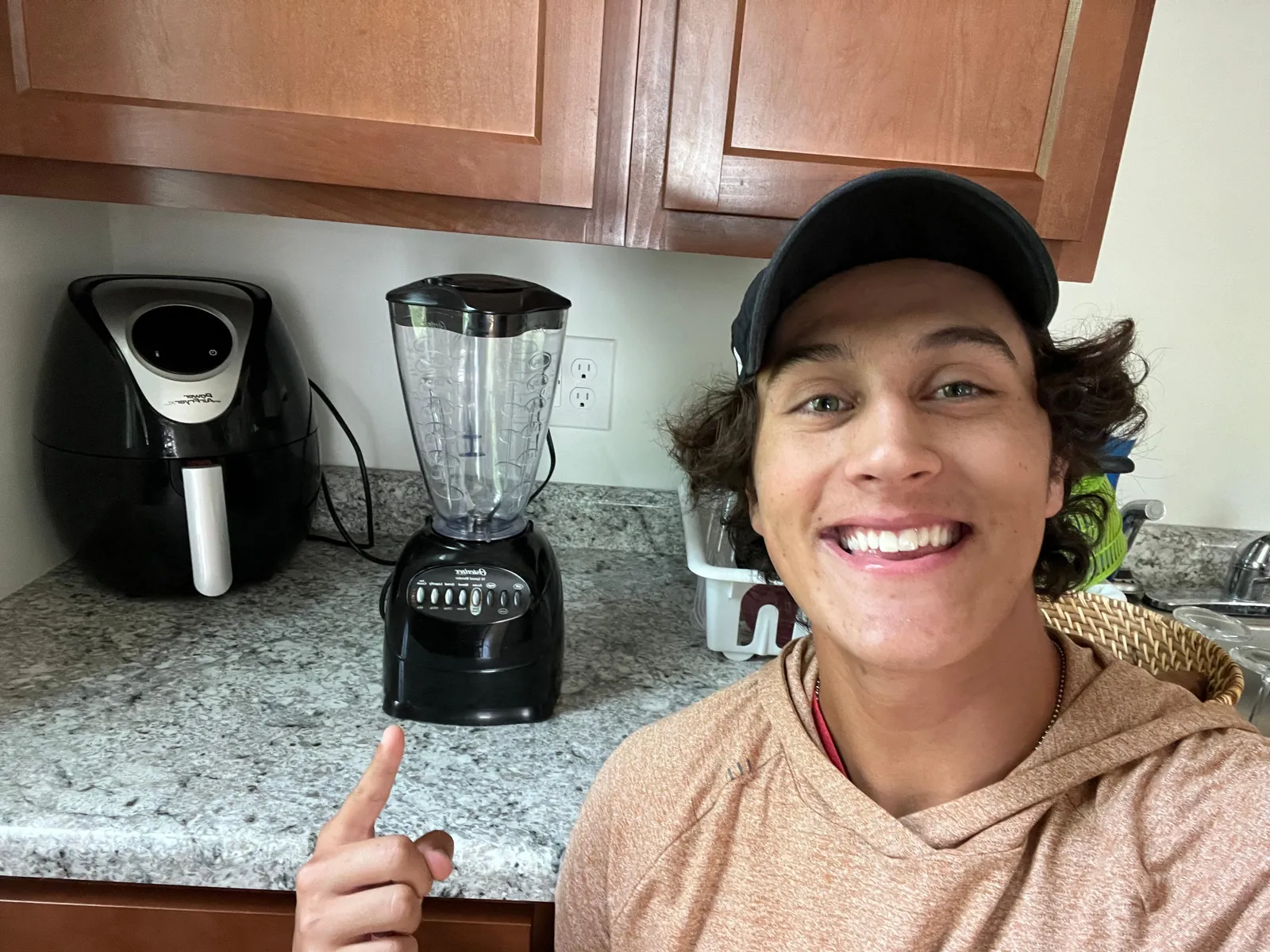 Basic Oster blender with dial and touchpad Oster Pro blender side by side