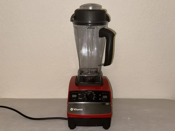 Bent shaft causing wobble in Vitamix blender base indicating repair failure