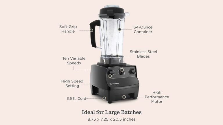 A black Vitamix blender on a white marble counter beside frozen bananas, kale, and oats in natural soft light.