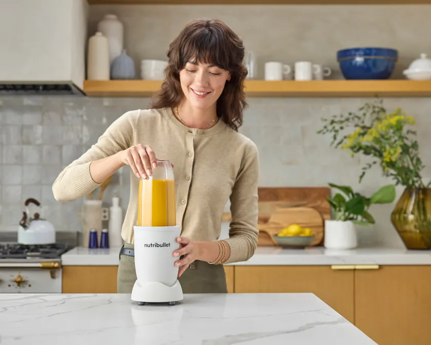 Blender cup near hot tea and soda illustrating safety rules