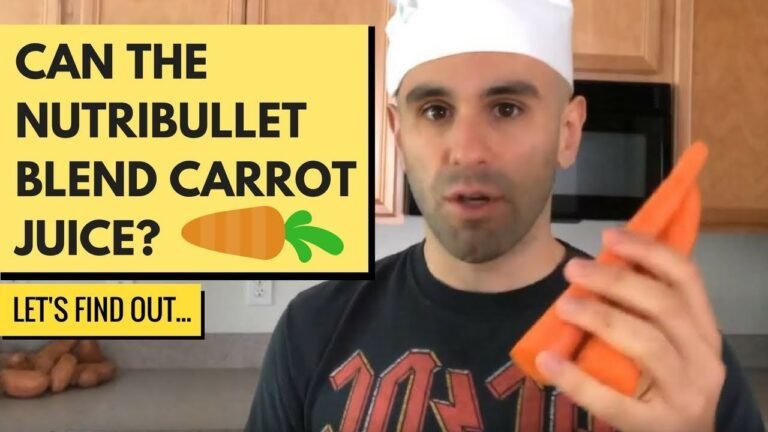Carrot chunks and water in a bullet blender cup on a kitchen counter