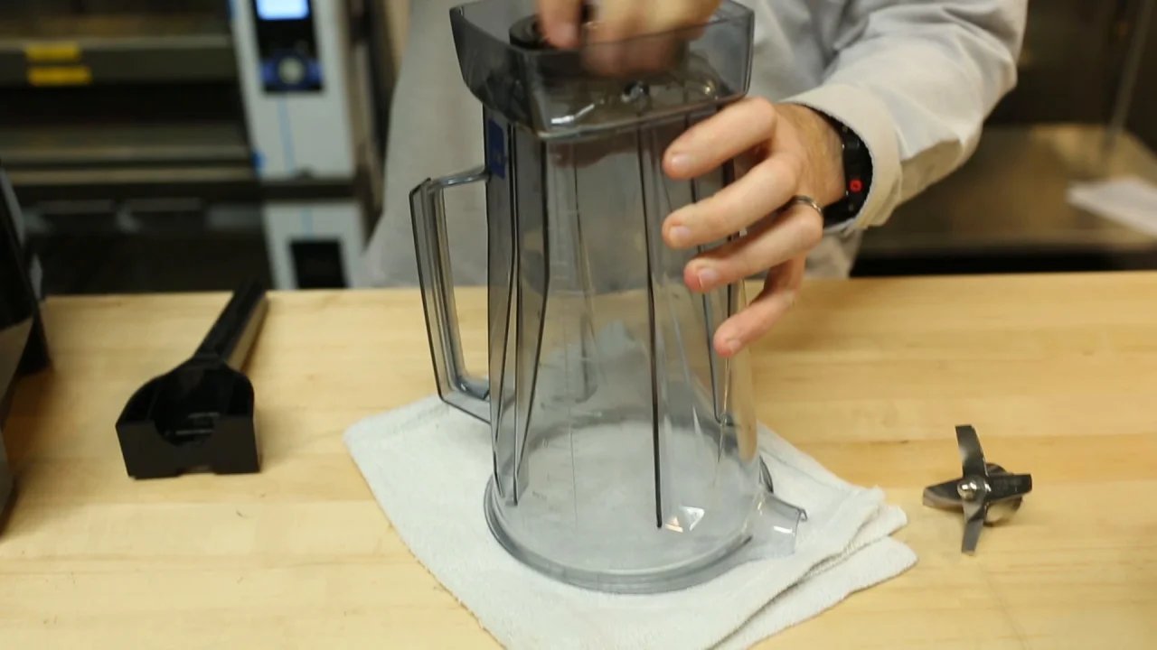 Clean Vitamix blender jar on counter with fresh ingredients ready for smoothies