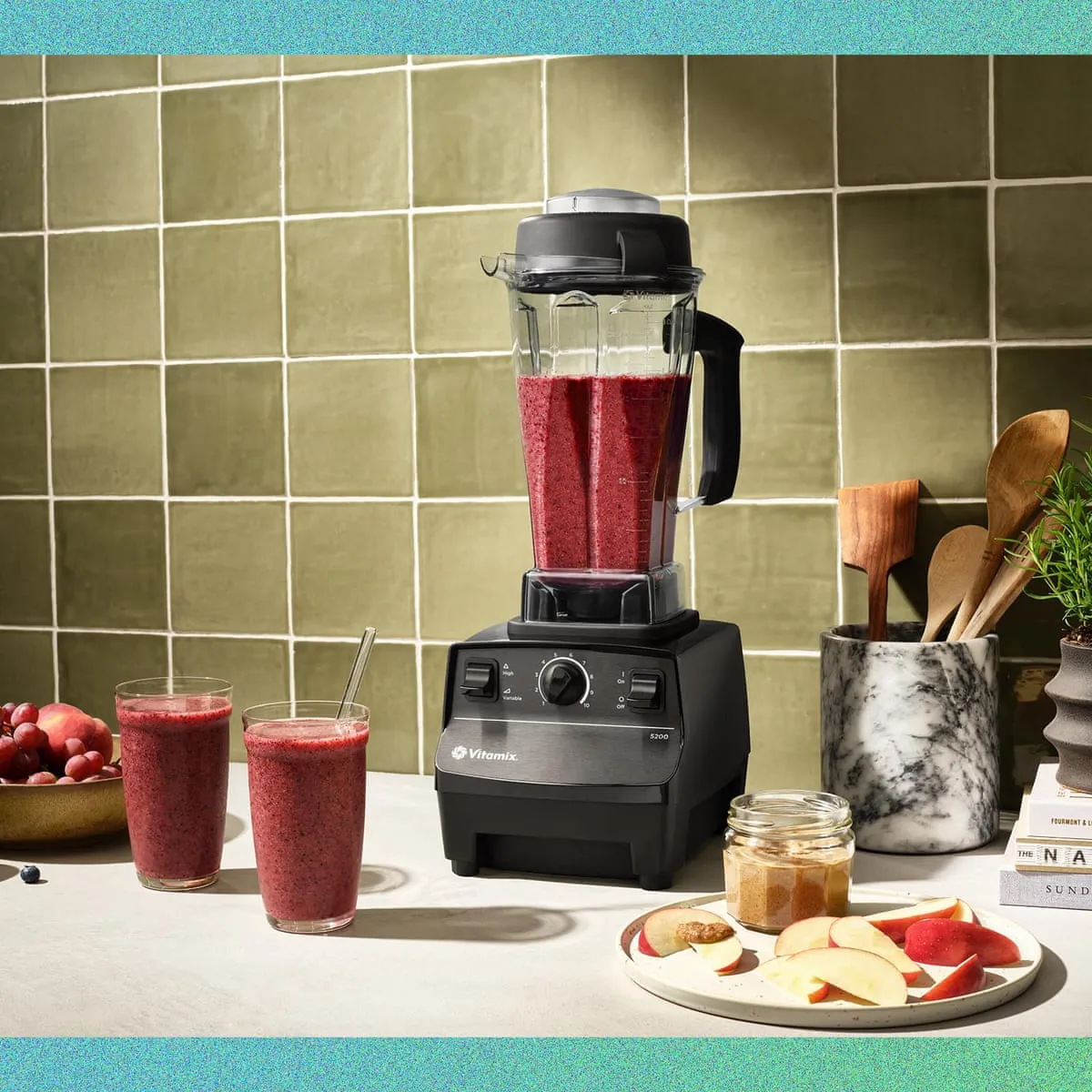 Clear juice and a thick smoothie are compared on a clean kitchen table.