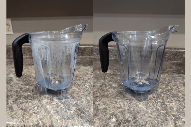 Clear Vitamix blender jar on a white counter ready for cleaning