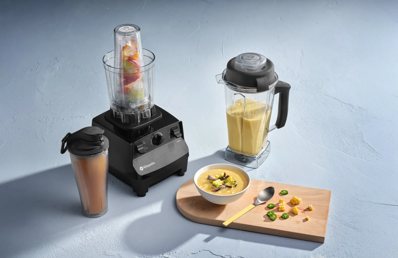 Close-up of blender blades processing a smooth and creamy almond butter mixture.