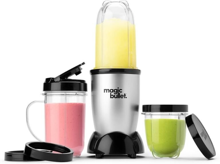 Compact personal blender on a kitchen counter with a green smoothie