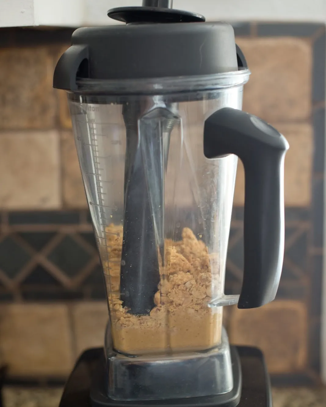 Comparison of smooth versus grainy homemade peanut butter textures in jars