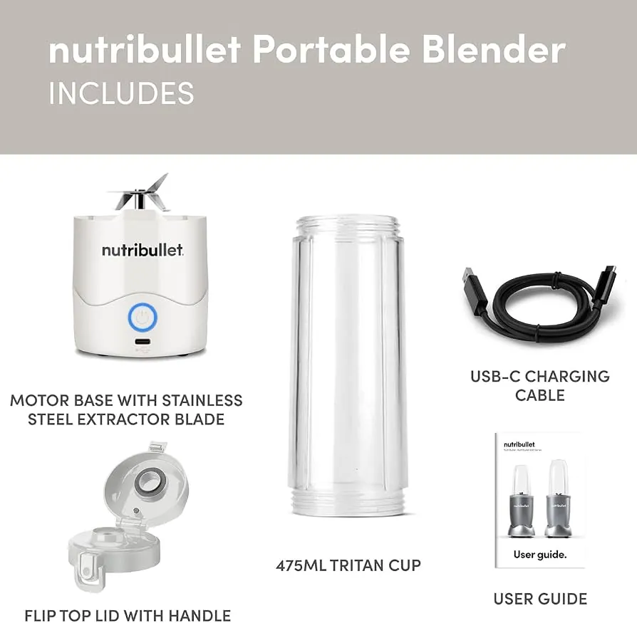 Countertop blender plugged into wall beside portable blender