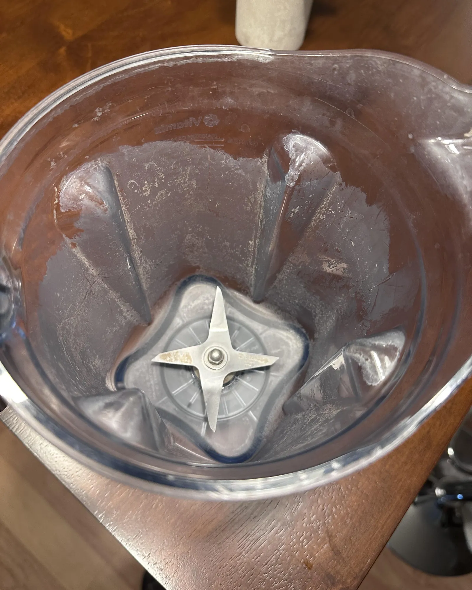 Dish soap and sponge arranged on a kitchen island for cleaning