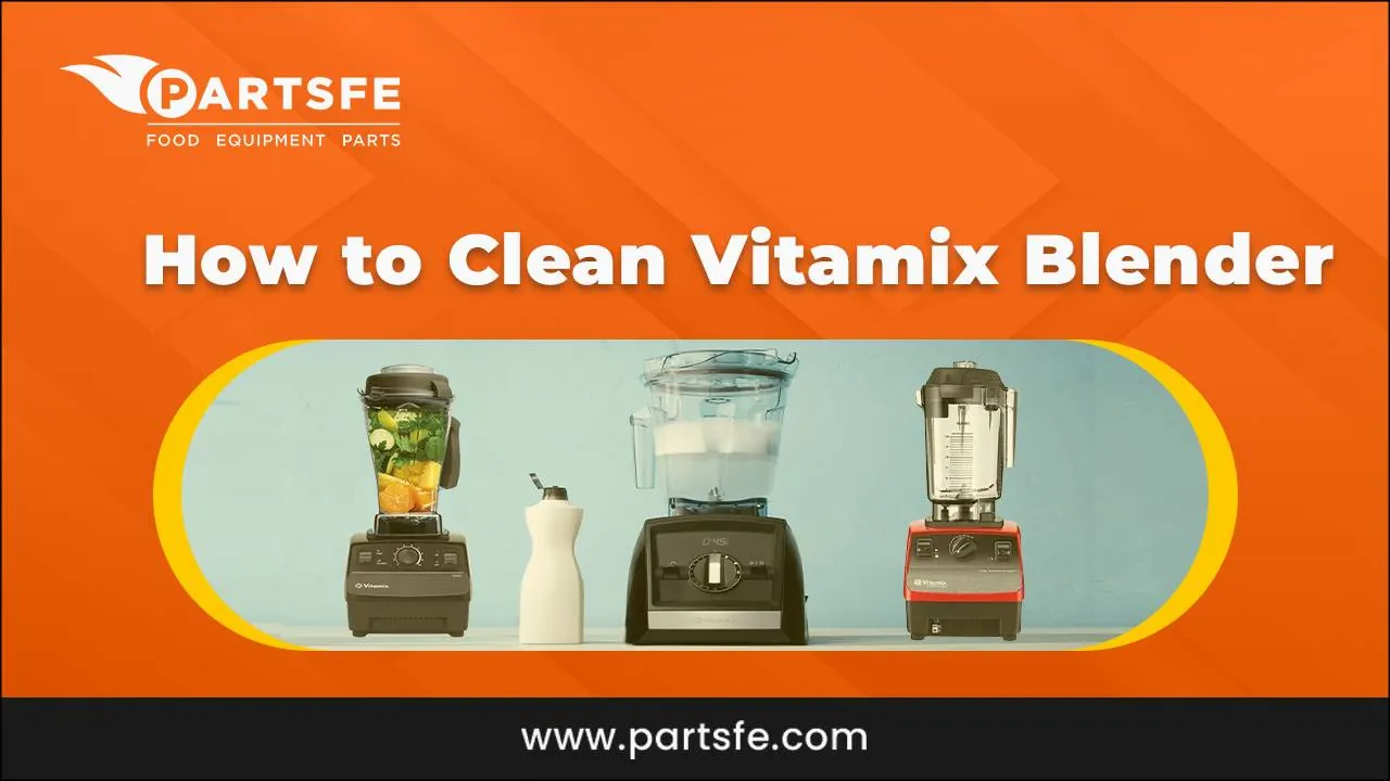 Dried smoothie residue stuck to Vitamix blender blades in a pitcher