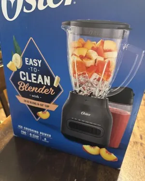 Glass and plastic blender jars placed in dishwasher rack