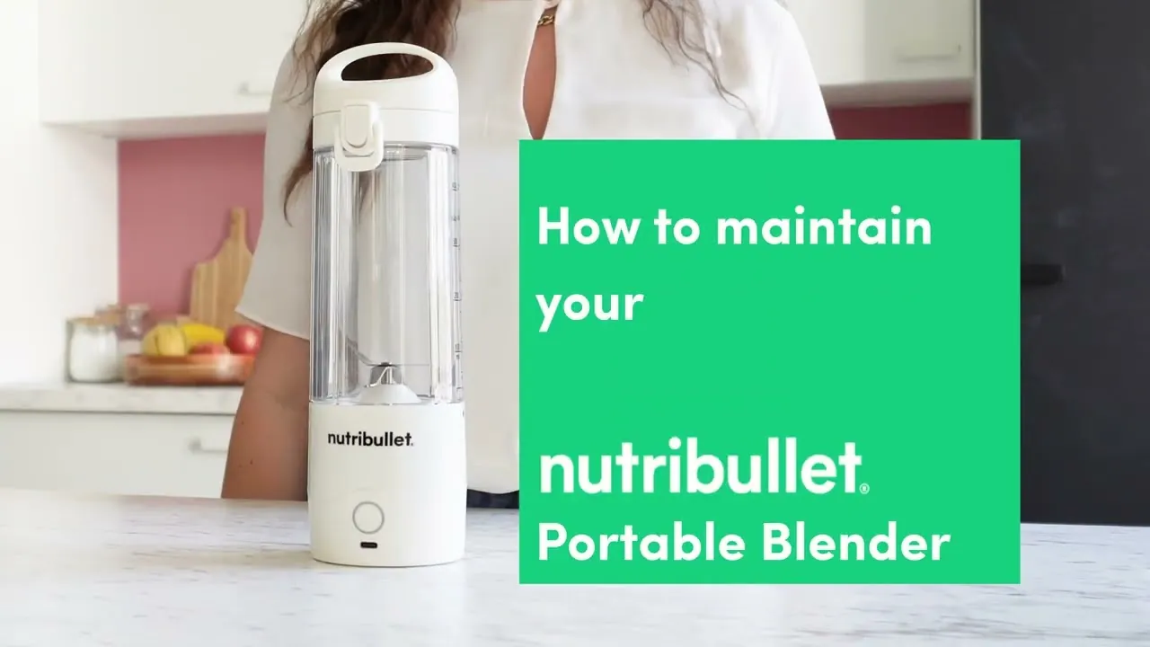 Green smoothie residue in a blender cup before a quick daily cleaning