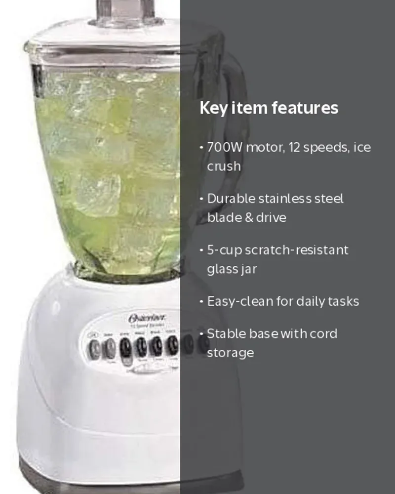 Hand adding fruit and yogurt to an Oster 12 speed blender jar