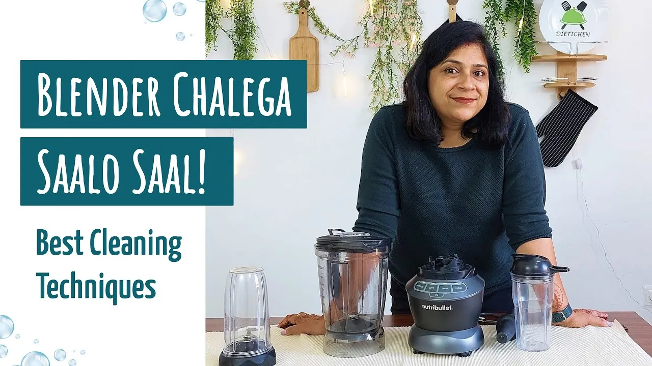 Hands rinsing a Nutribullet cup with soapy water at a kitchen sink