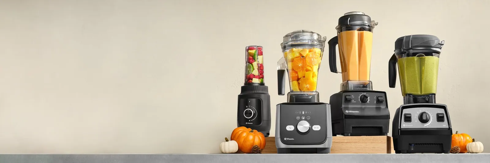 Hands securing the lid on a Vitamix blender for safe use