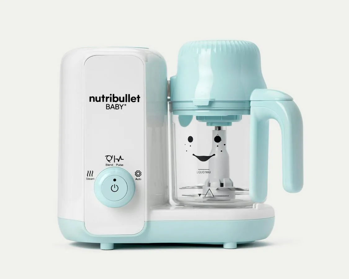 Hands separating steamer basket and blender cup for careful cleaning