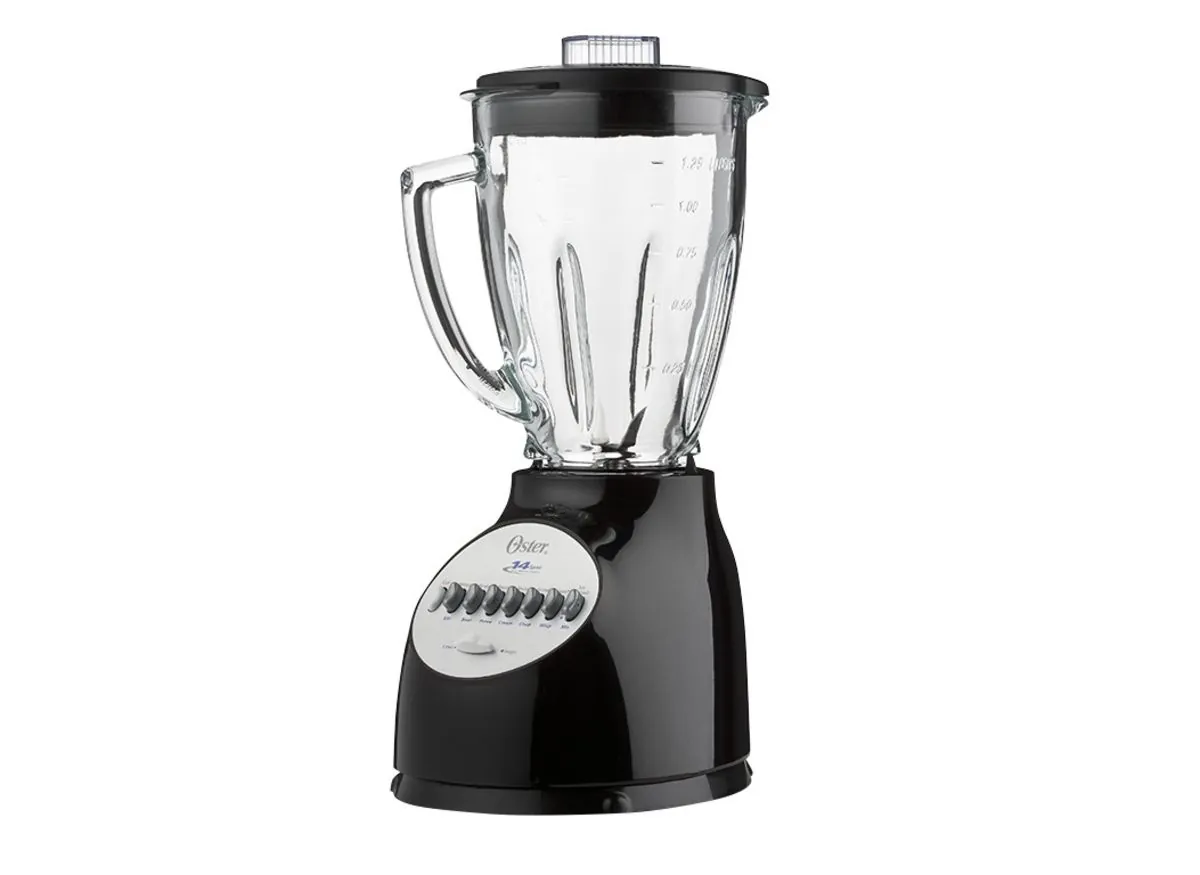 Hands unboxing a new Oster 14-speed blender on a counter