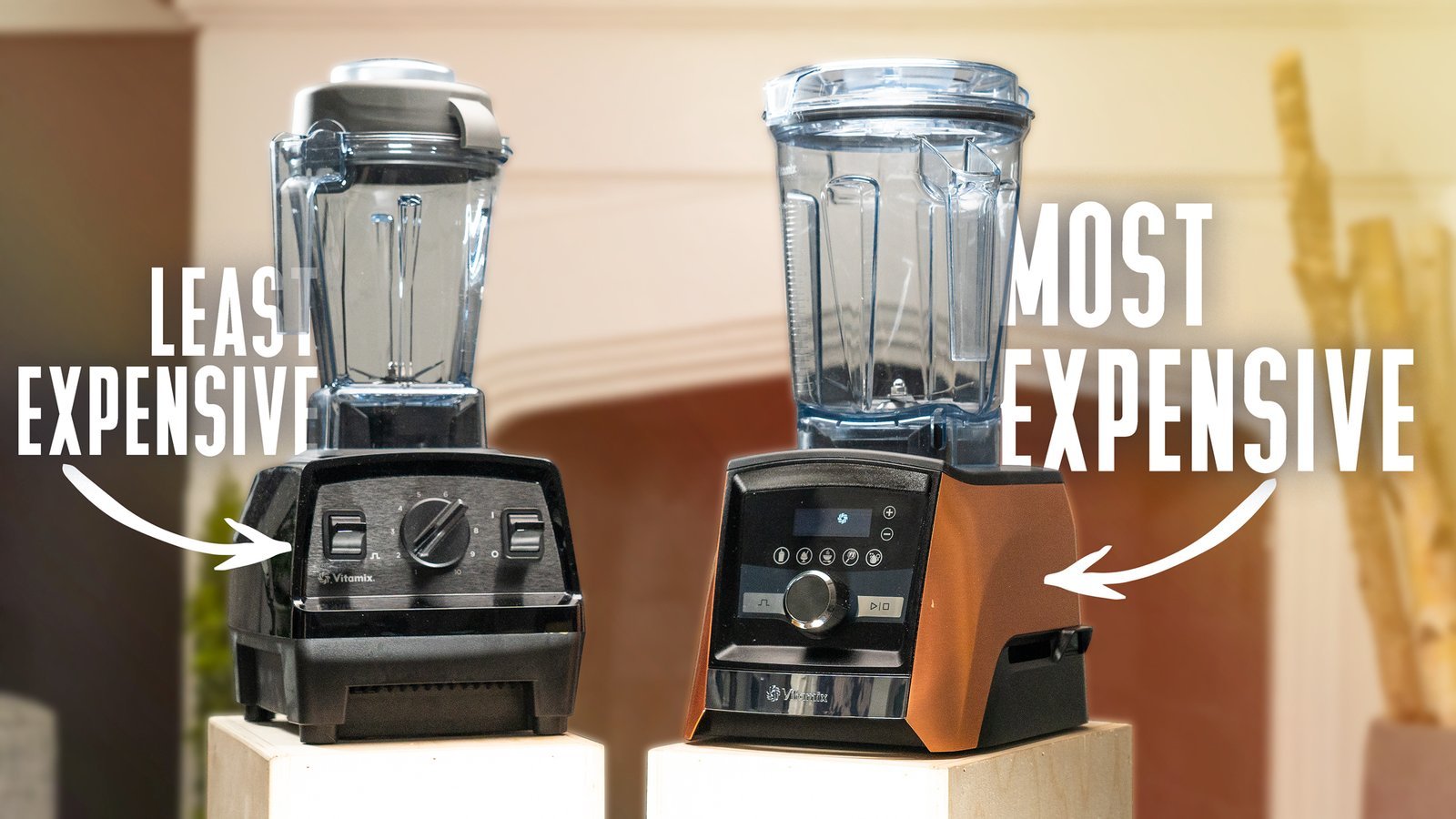 A high-end professional blender sits on a marble countertop in a bright kitchen.