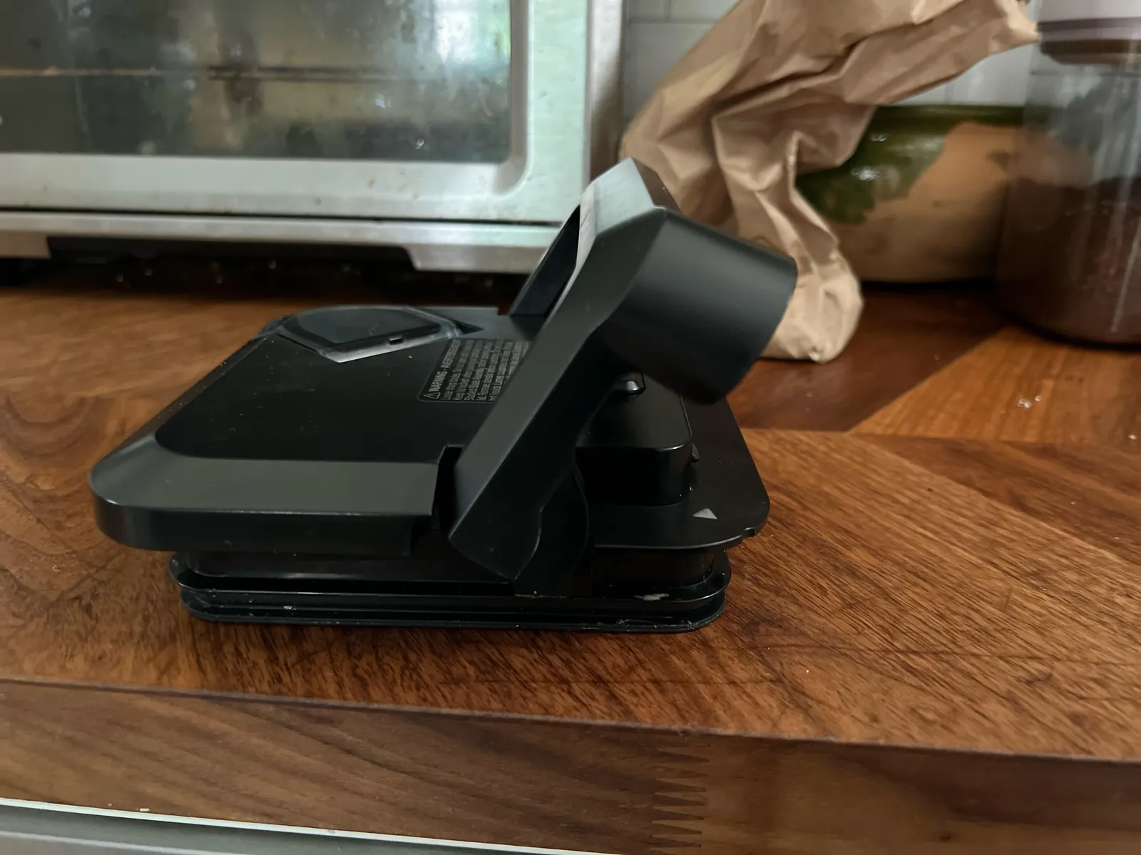 Home cook carefully aligns the locking lid on a Ninja blender pitcher.