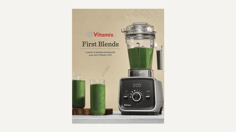 A home cook preparing healthy ingredients in a standard blender on a kitchen counter.