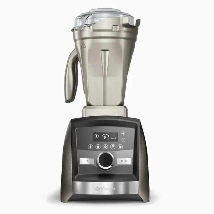 A home cook uses a Vitamix blender to prepare healthy meals in a kitchen.