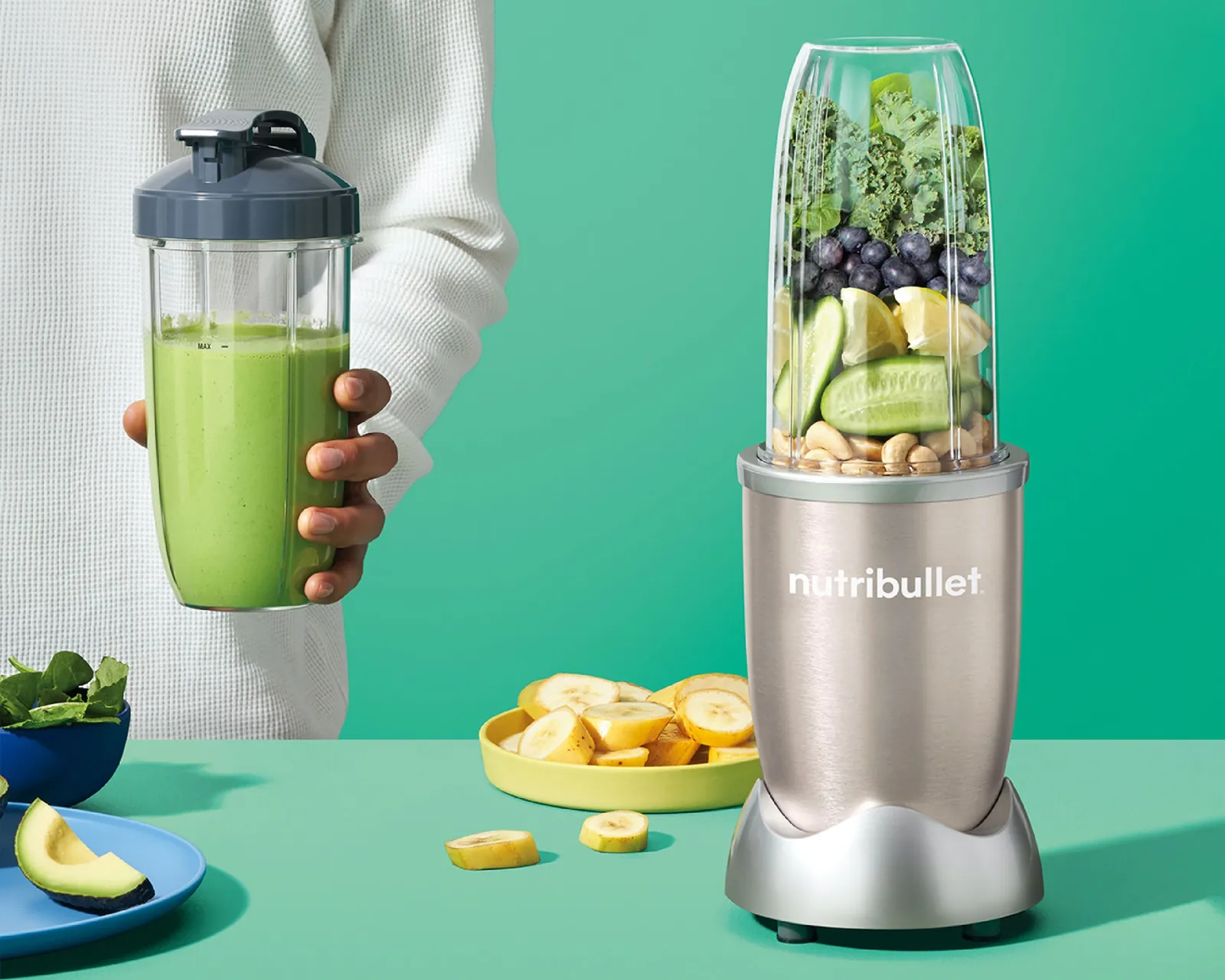 Magic Bullet and NutriBullet blenders with different smoothies on a kitchen counter