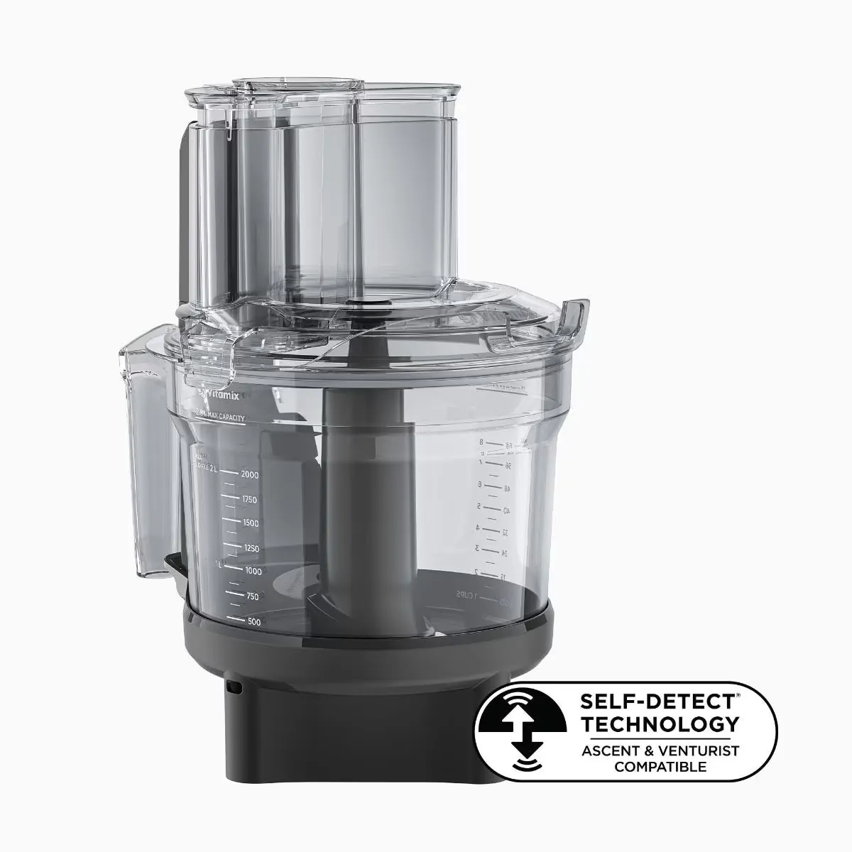 A modern food processor being used to shred a large block of cheese.