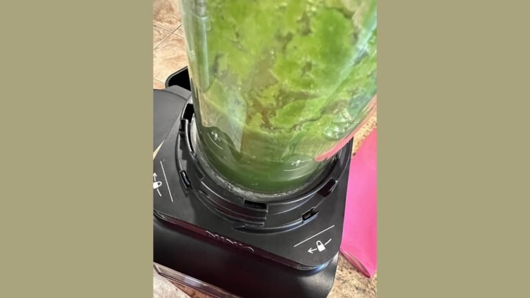 A modern Ninja blender sits on a kitchen counter, ready for troubleshooting steps.