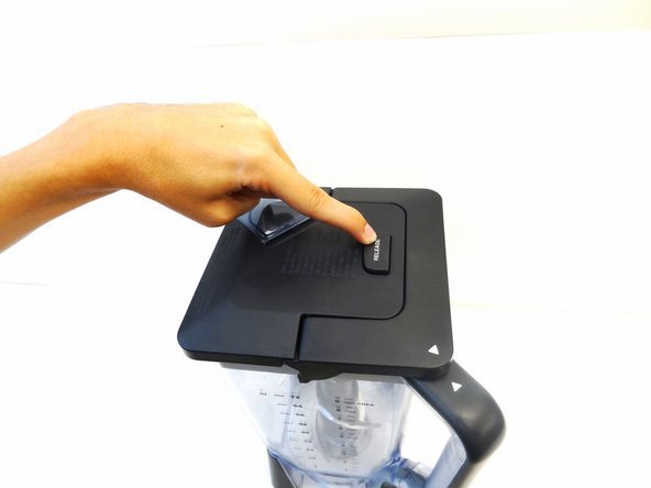 A modern Ninja blender sits on a kitchen counter ready for lid attachment.