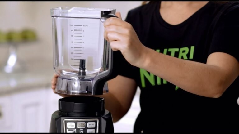 A Ninja blender system sits on a clean kitchen counter for easy use.