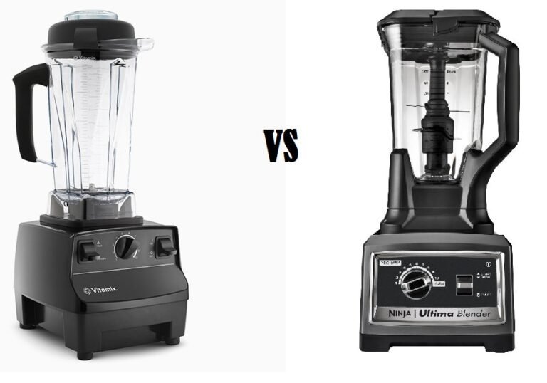 A Ninja blender and a Vitamix blender stand together on a marble kitchen counter.