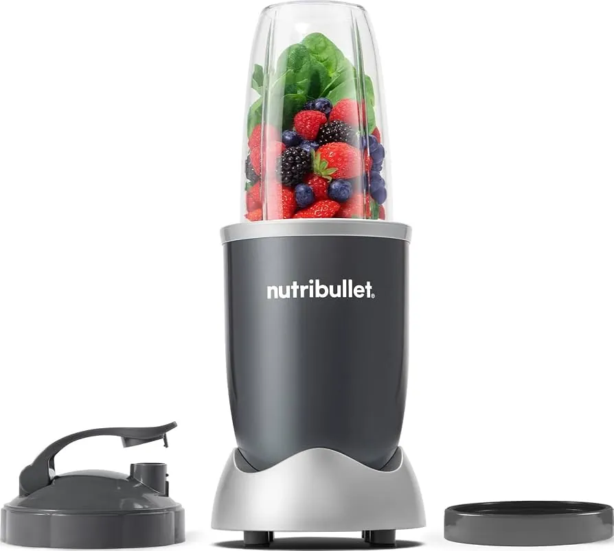 Nutribullet 600 paused mid-blend with thick frozen fruit and a towel nearby