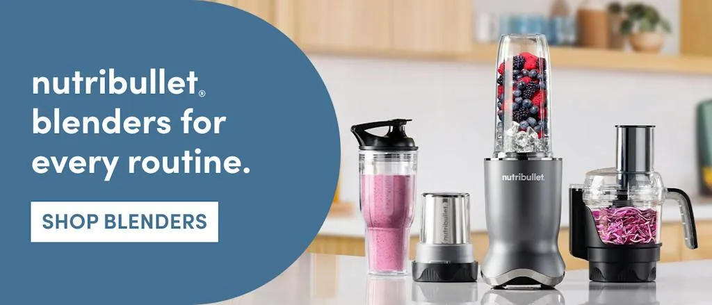 Nutribullet blender cup with fixed blades beside a white motor base