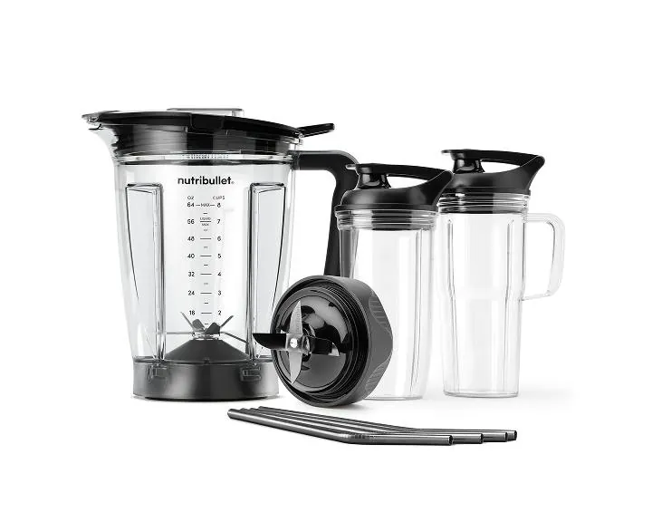 Nutribullet blender pitcher with drying green smoothie foam on a counter