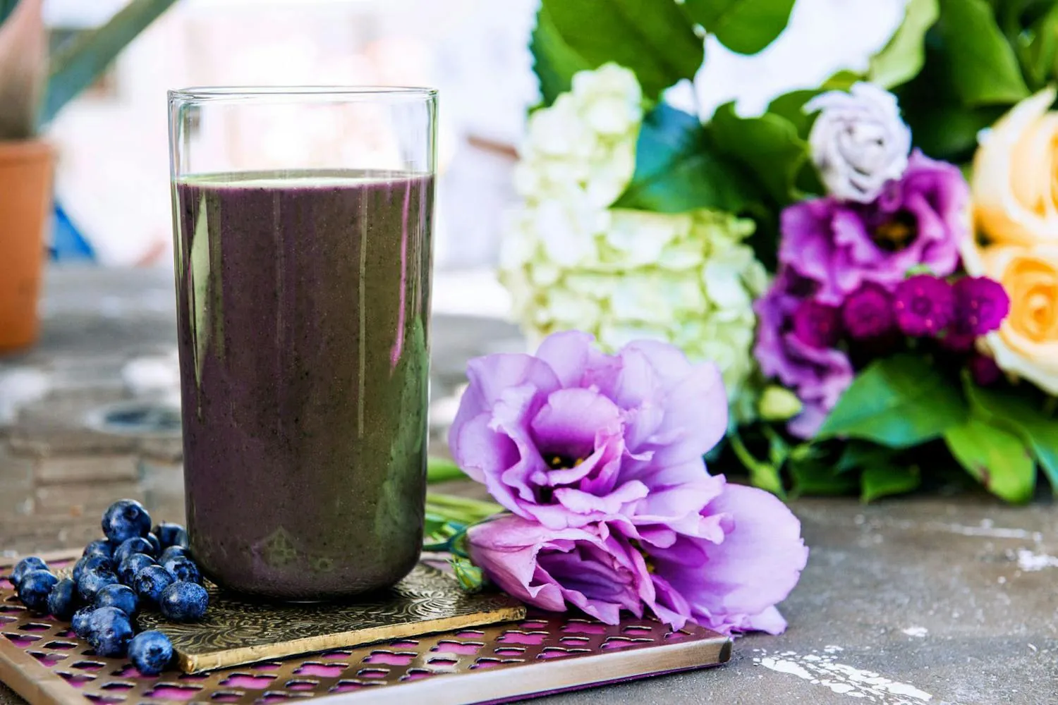 Nutribullet cup and blade beside celery for a quick green blend