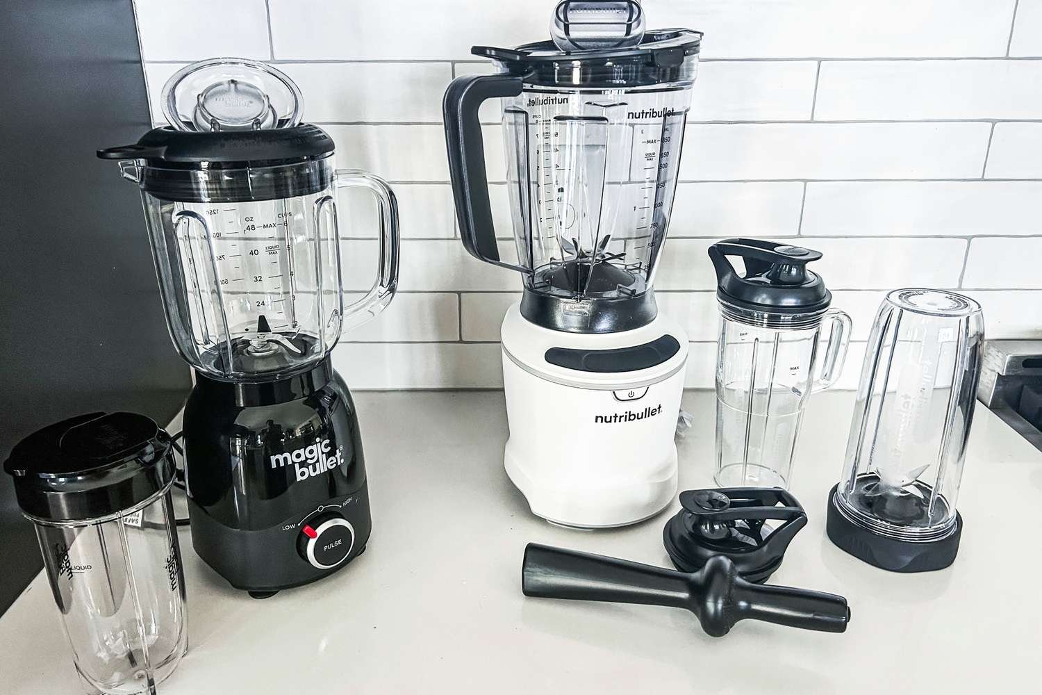 Nutribullet and Magic Bullet blenders side by side on a kitchen counter