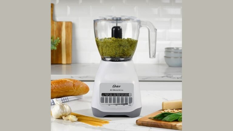 Oster blender and food processor bowl on a kitchen counter