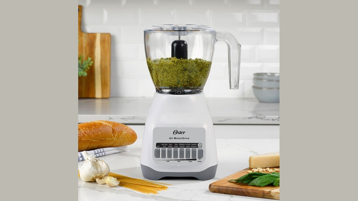 Oster blender and food processor bowl on a kitchen counter