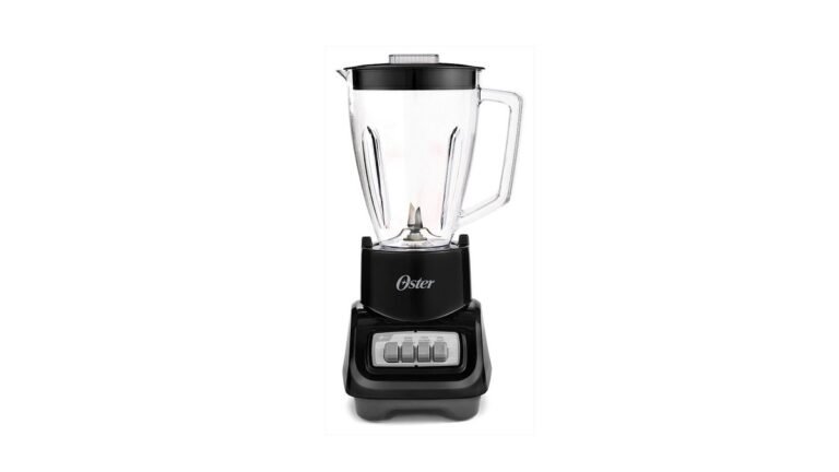 Oster blender with glass jar on a kitchen counter beside frozen fruit