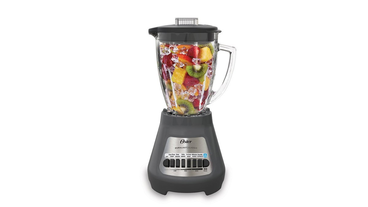 Oster Classic Series 8-Speed Blender on a kitchen counter with fresh orange