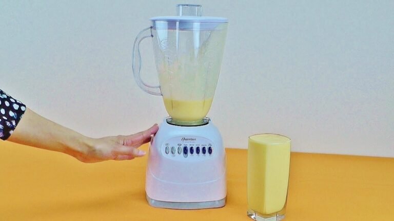 Oster countertop blender on a kitchen counter ready to be switched on
