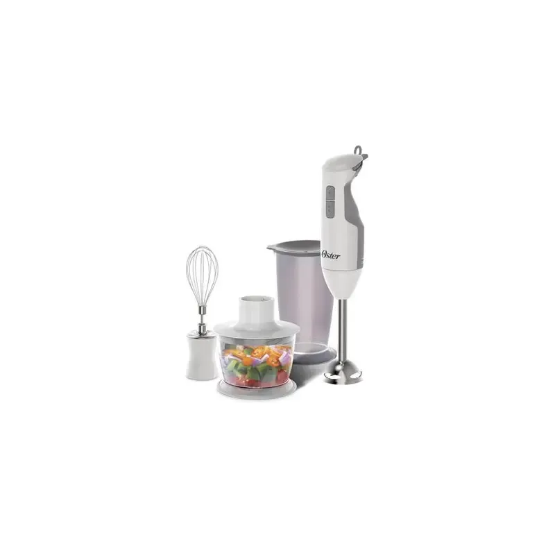Oster hand blender blending tomato soup in a tall beaker