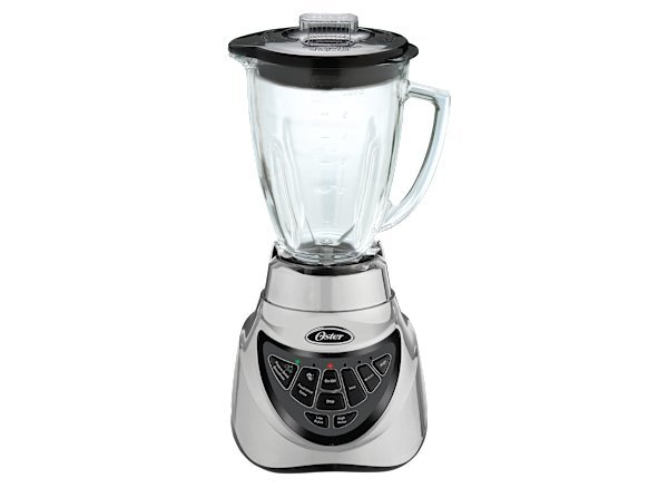 Oster Pro 500 blender on a kitchen counter with frozen fruit nearby