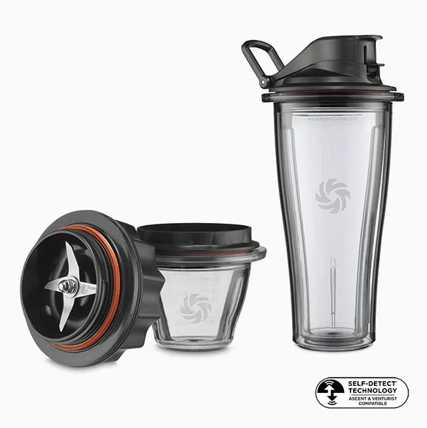 A perfectly portioned green smoothie prepared inside a Vitamix personal blending cup.