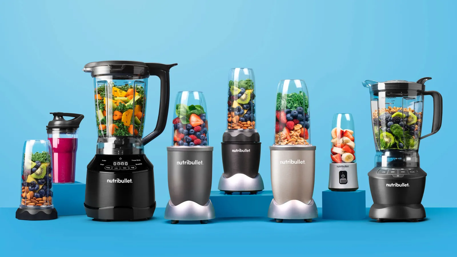 Personal blender beside a large blender comparing single-serve capacity