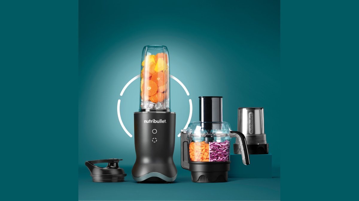 Personal blender cup of warm tomato soup on a kitchen counter