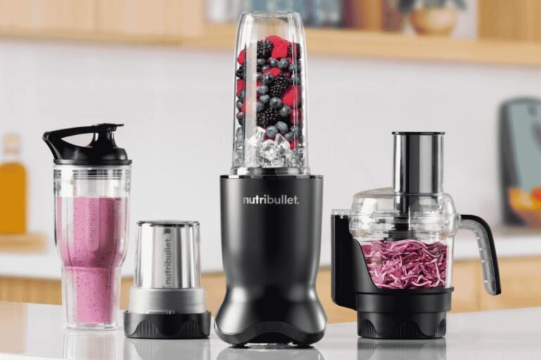 Personal blender with fruit smoothie on a bright kitchen counter