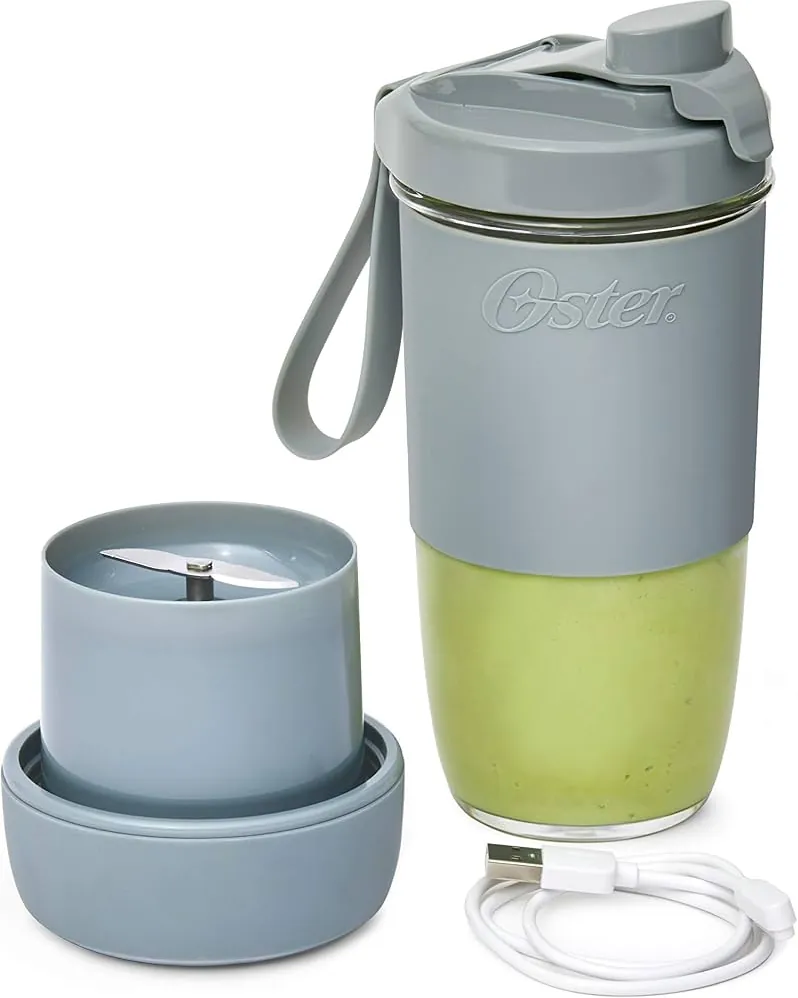 Portable blender on a kitchen scale with fruit nearby