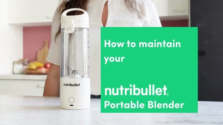 A portable blender and smoothie on a bright kitchen counter
